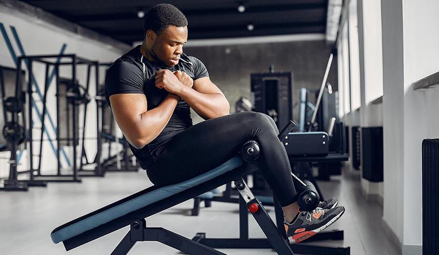 Man Wearing Shoes at the Gym